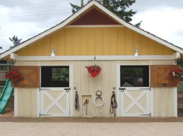 The exterior of a two door horse barn